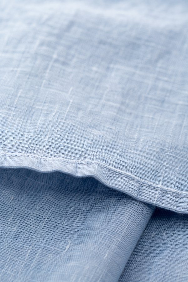 Macro detail of washed pure linen in warm cream